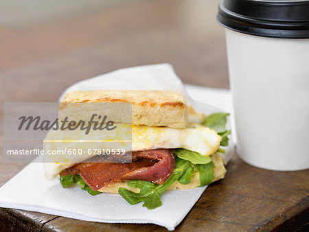 Bacon and Egg Breakfast Sandwich with Takeout Coffee, Studio Shot