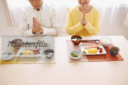 Senior adult Japanese couple in the kitchen