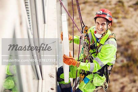 Industrial climber on a building