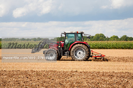 Tractor with plow in the field