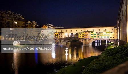 Famous Ponte Vecchio night view over Arno river in Florence, Italy