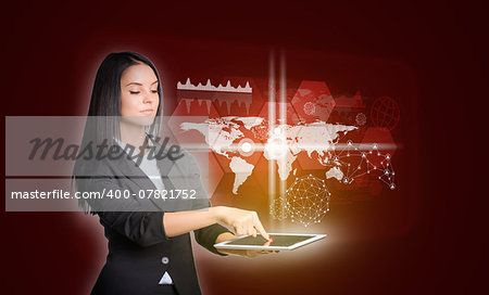 Beautiful businesswomen in suit using digital tablet. World map with transparent hexagons, graphs and network