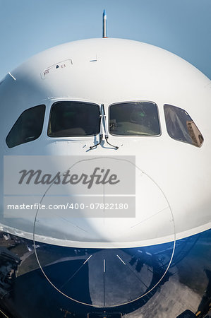 nose cone closeup of a larger passenger jet airliner