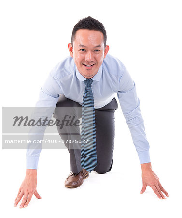Asian business man on starting line of a race, front view full length isolated over white background.