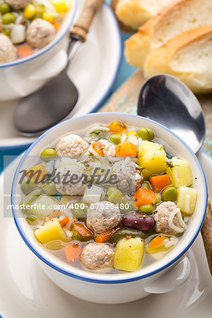 Delicious meatball soup with vegetables in a bowl