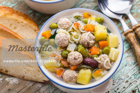 Delicious meatball soup with vegetables in a bowl