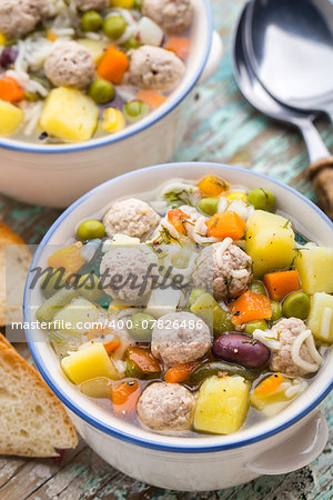 Delicious meatball soup with vegetables in a bowl