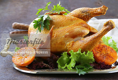 baked chicken with oranges and herbs for festive dinner