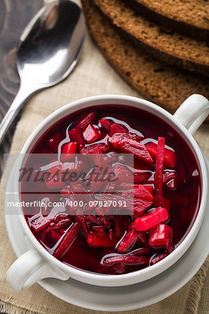 Vegetarian red beetroot soup in a white bowl