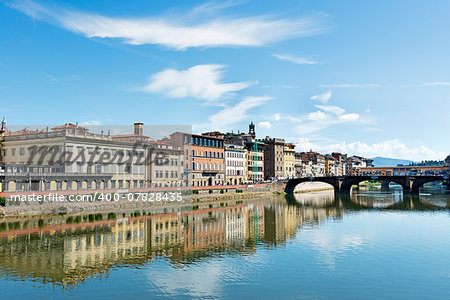 Image of houses, river Arno and ponte Vecchio in Florence, Italy in autumn on a sunny day
