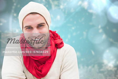 Handsome hipster against blurred christmas background