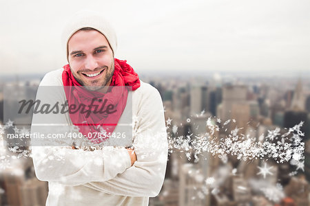 Handsome hipster against city skyline