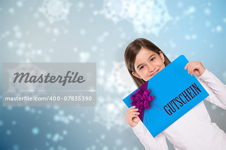 Cute little girl showing card against digitally generated delicate snowflake design