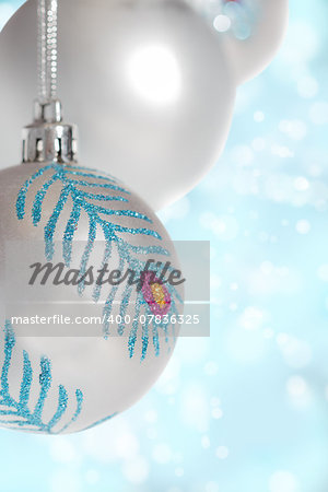 silver Christmas ball on blue background   bokeh