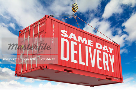 Same Day Delivery - Red Hanging Cargo Container on Sky Background.