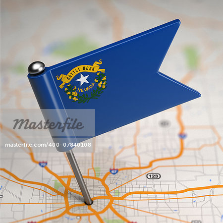 Small Flag of Nevada on a Map Background with Selective Focus.