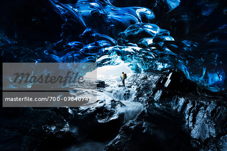 Interior of Ice Cave with Mountain Guide, Iceland