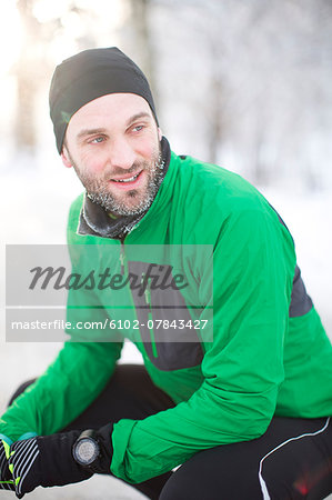 Mid adult man in sports clothes at winter