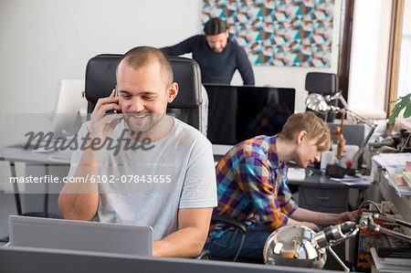 Young men in office