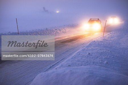 Cars on country road at winter