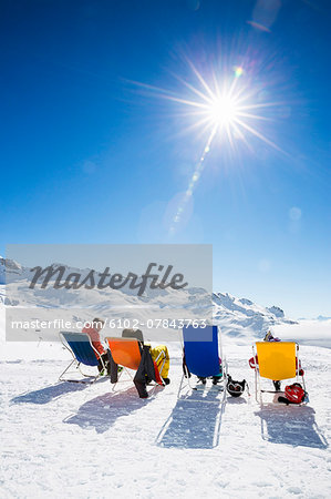 Friends sunbathing in mountains