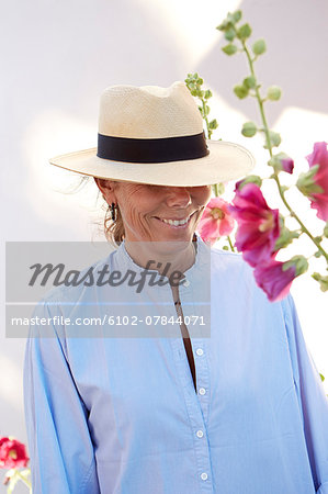 Mature woman wearing sun hat