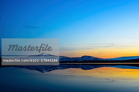 Scenic sunset reflecting in water