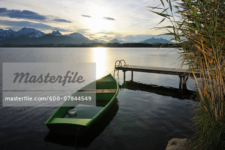 Rowboat with Sun Reflecting on Lake, Hopfen am See, Lake Hopfensee, Bavaria, Germany