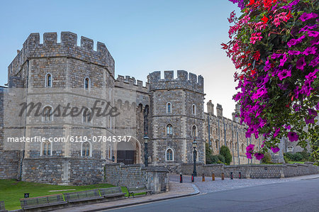 Windsor Castle in the morning with flowers in hanging baskets, Windsor, Berkshire, England, United Kingdom, Europe