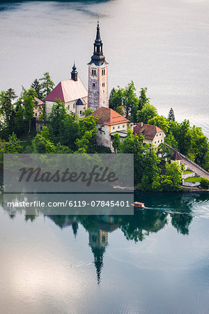 Lake Bled boat (Pletna) at Lake Bled Island at sunrise, Gorenjska, Slovenia, Europe