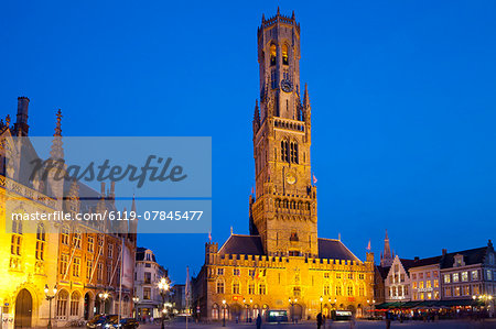 The Belfry and Market Square lit up at night in the Historic Center of Bruges, UNESCO World Heritage Site, Belgium, Europe