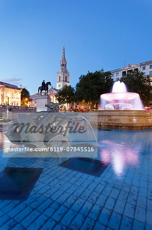 Fountain with statue of George IV and St. Martin-in-the-Fields church, Trafalgar Square, London, England, United Kingdom, Europe