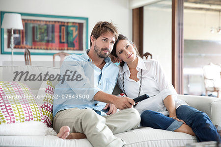 Couple watching TV together