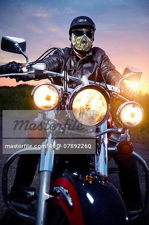 Biker on the motorbike outdoors
