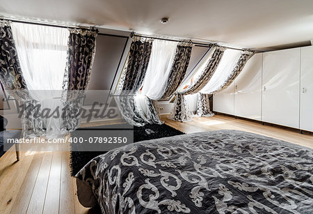 Interior of fashionable bedroom
