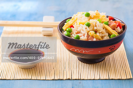 chinese fried rice with peas on white plate