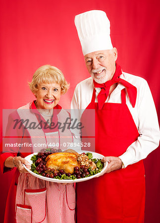 Senior couple works together to prepare a delicious holiday meal.