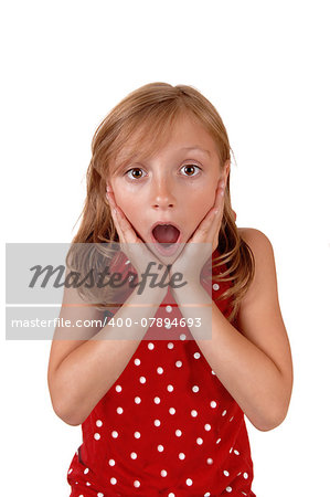 A lovely young girl in a red sweater holding her hands on her face, looking very surprised, isolated for white background.