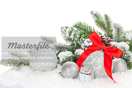 Christmas baubles with red ribbon and fir tree. Isolated on white background