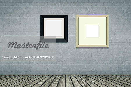 An empty room with two picture frames