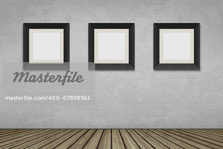 An empty room with three picture frames