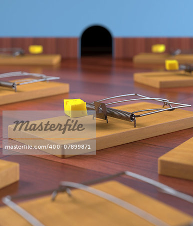 Several mousetrap with cheese on a wooden floor. Depth of field in cheese.