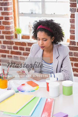 Interior designer looking at colours at her desk