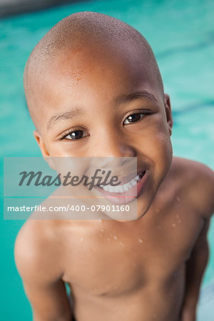 Cute little boy smiling at the pool at the leisure center