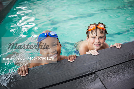 Little boys smiling in the pool at the leisure center