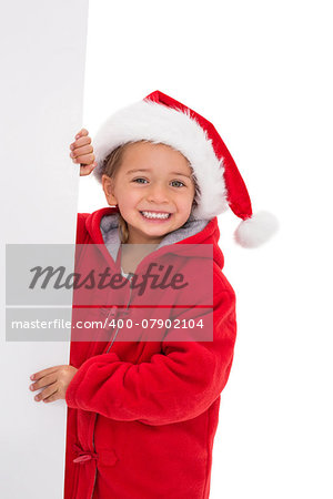 Festive little girl holding poster on white background