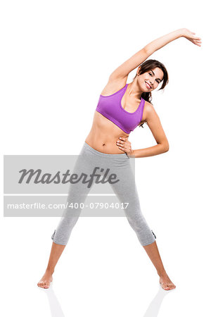 Beautiful and healthy woman stretching, isolated over a white background