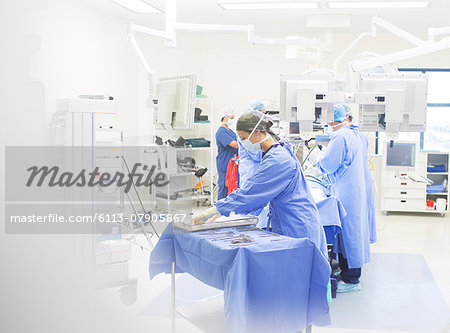 Team of surgeons performing surgery in operating theater