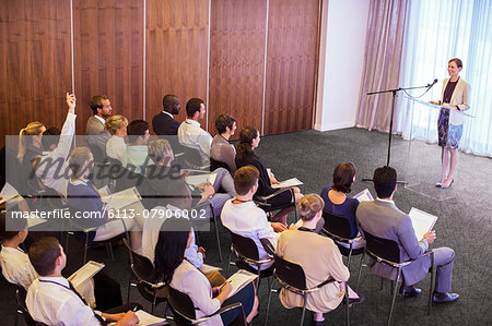Mid adult businesswoman giving presentation in conference room