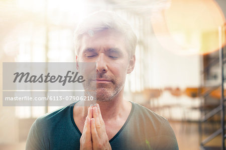 Close up of older man meditating